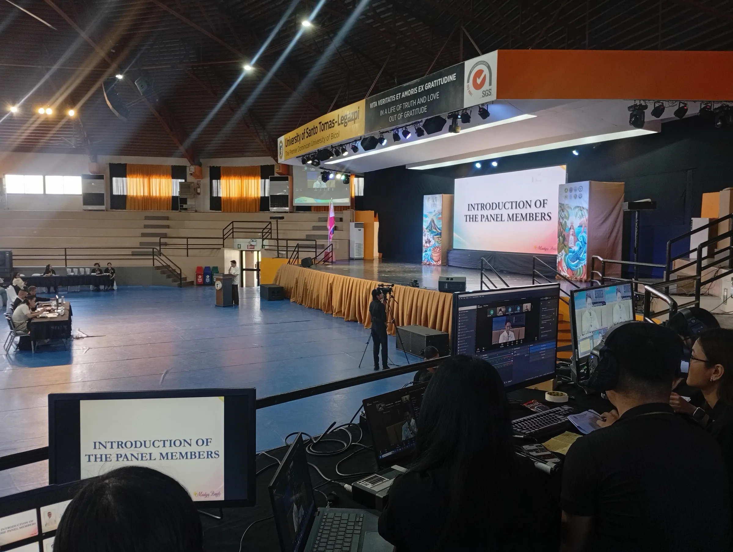 The production desk in the gym, laptops facing the stage.