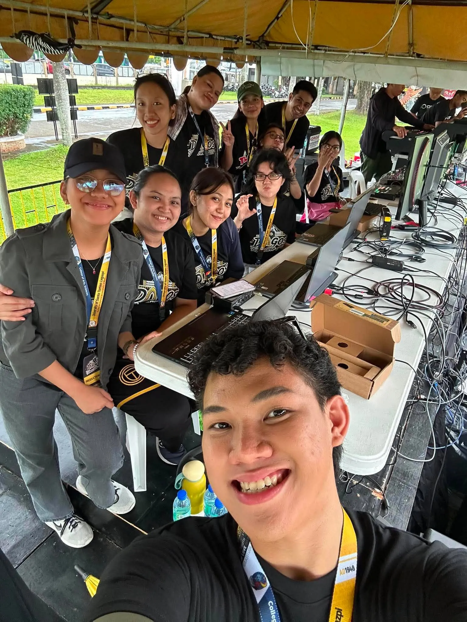 A group selfie of the production crew at their tent.