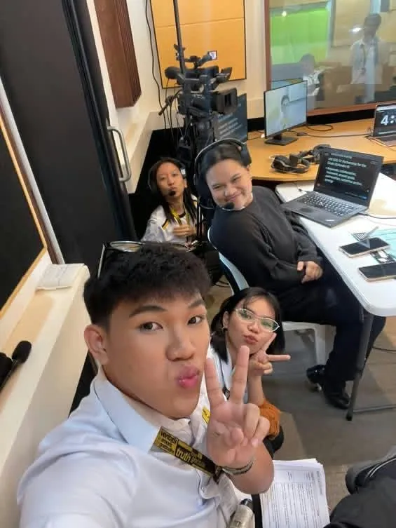A crew member’s selfie with a peace sign in the control room.