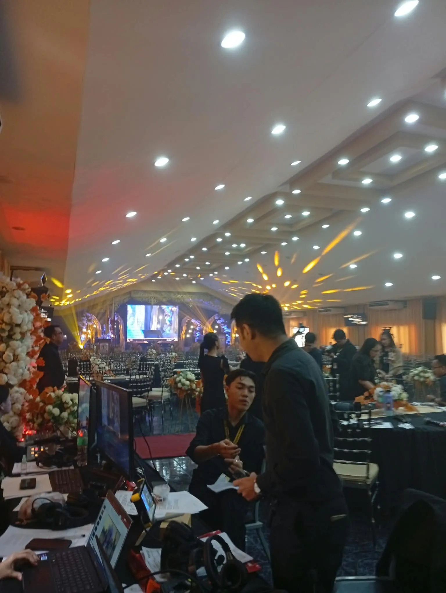 A crew member at the controls in the ballroom.