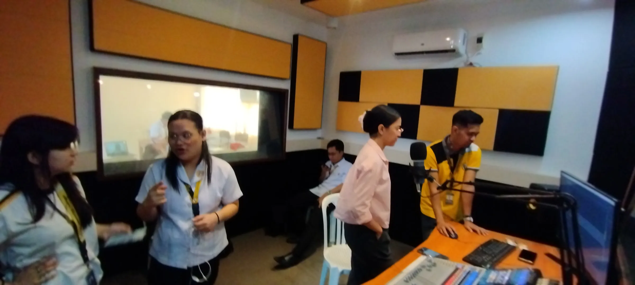 The team gathered in the studio after recording.