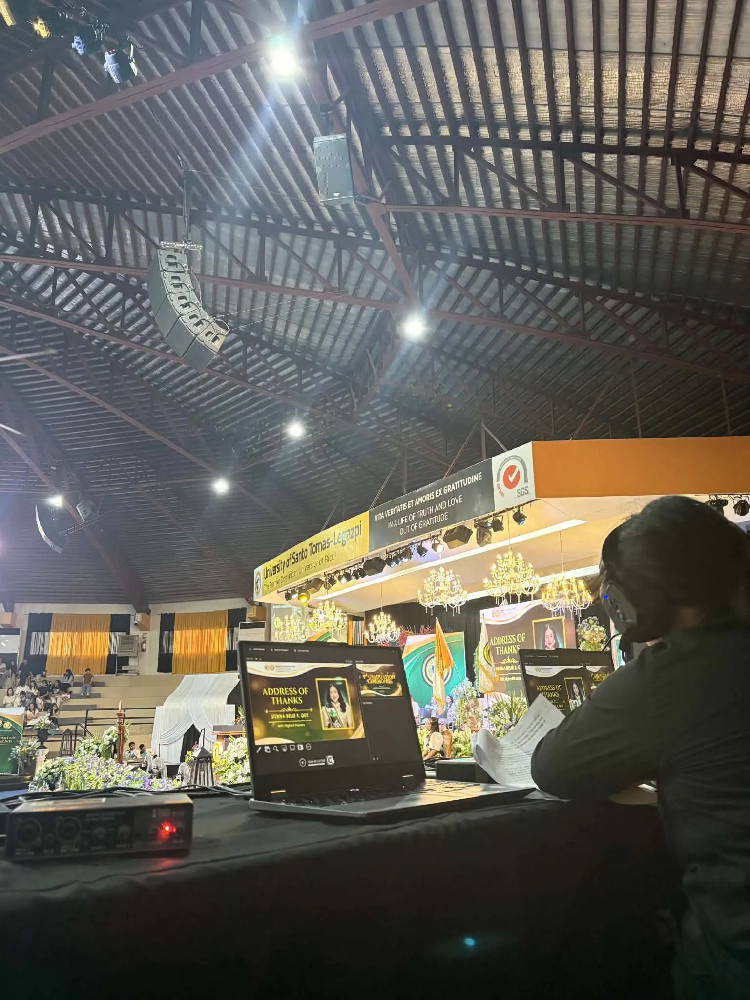 The production desk at the side of the gym during the program.