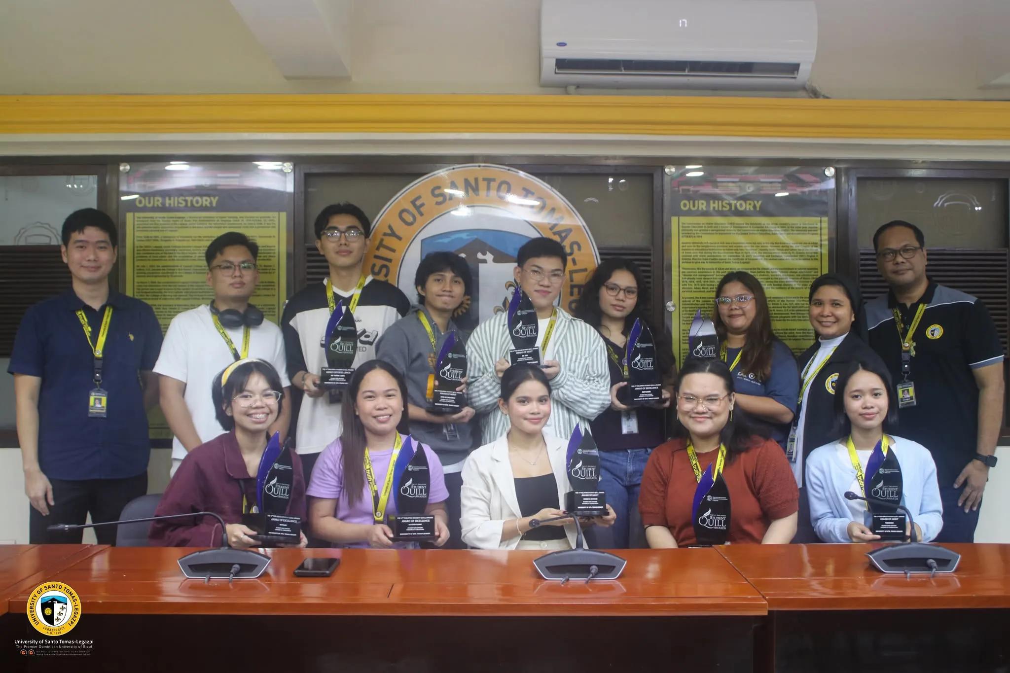 The award-winning team posing with their Quill trophies.